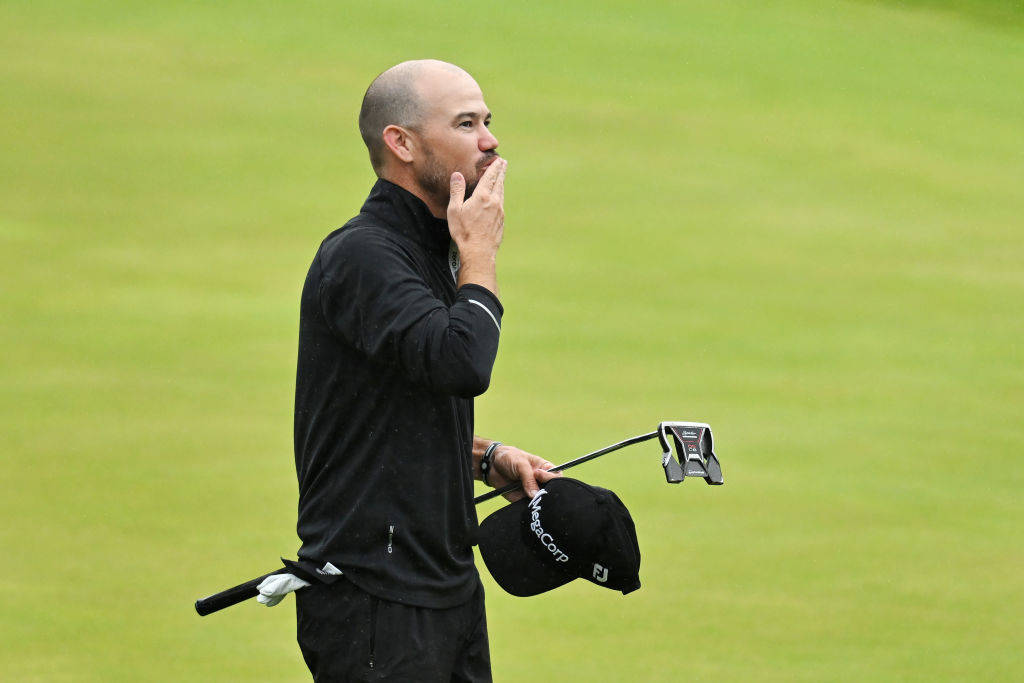 Brian Harman blows a kiss to the crowd